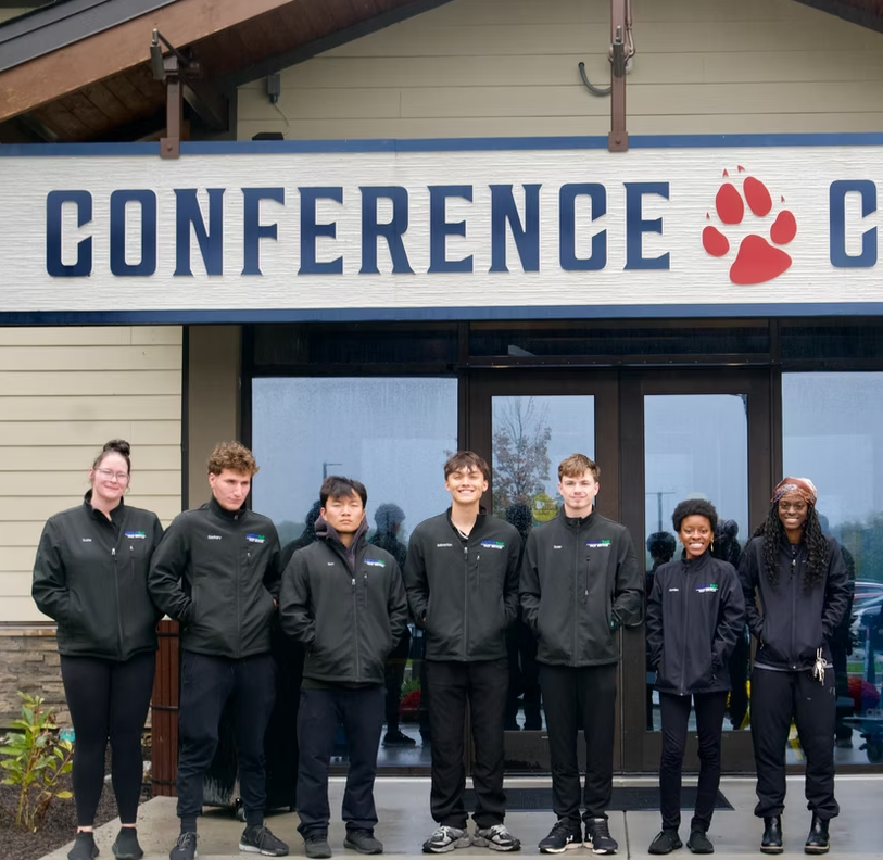 AbovePar team outside a conference center